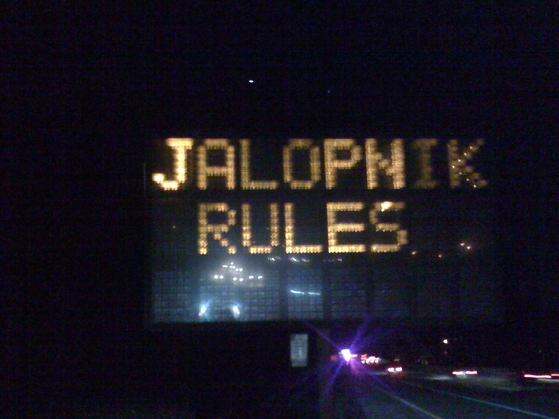 Illustration for article titled Jalopnik-Hacked Road Sign: We're All Going To Jail Now